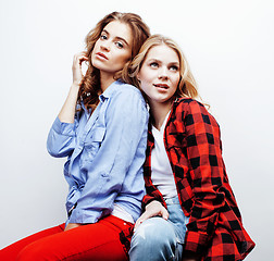 Image showing two pretty blond woman having fun together on white background, mature mother and young teenage daughter, lifestyle people concept