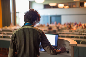 Image showing Public speaker giving talk at scientific conference.