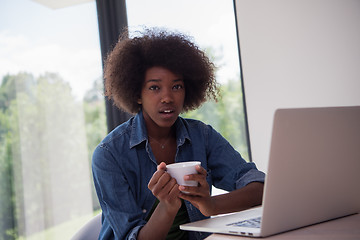 Image showing African American woman in the living room