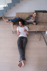 Image showing young couple relaxes in the living room