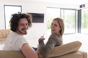 Image showing Rear view of couple watching television