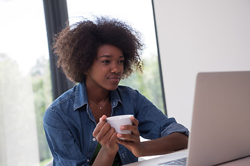 Image showing African American woman in the living room