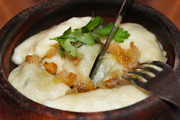 Image showing Varenyky with fried slices of bacon in restaurant