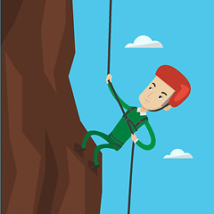 Image showing Man climbing in mountains with rope.