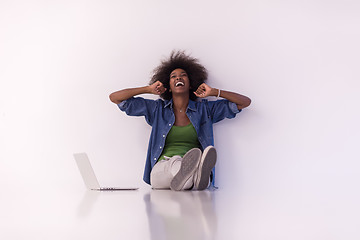 Image showing african american woman sitting on floor with laptop