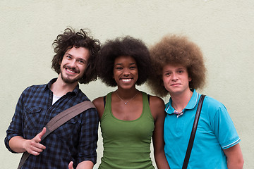 Image showing multiethnic group of happy three friends