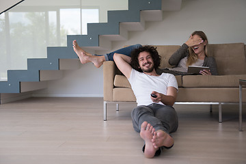 Image showing young couple relaxes in the living room