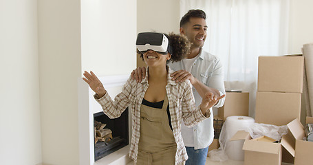 Image showing Happy young couple doing Virtual tour in new apartment