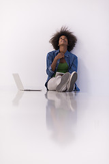 Image showing african american woman sitting on floor with laptop