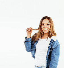 Image showing young pretty teenage hipster girl posing emotional happy smiling on white background, lifestyle people concept