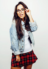 Image showing young pretty teenage hipster girl posing emotional happy smiling on white background, lifestyle people concept