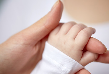 Image showing close up of mother and newborn baby hands