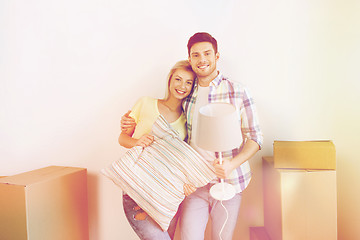 Image showing happy couple with stuff moving to new home