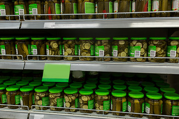 Image showing jars of pickles on grocery or supermarket shelves