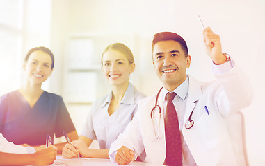 Image showing group of happy doctors on conference at hospital