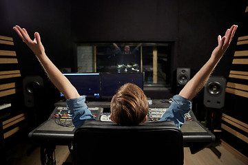 Image showing man at mixing console in music recording studio