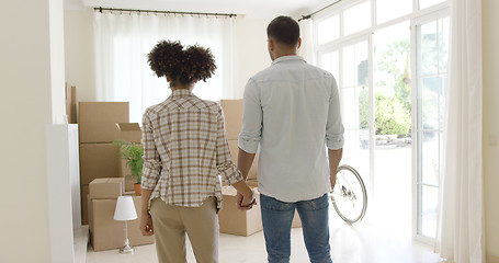 Image showing Loving young couple saying goodbye to their home