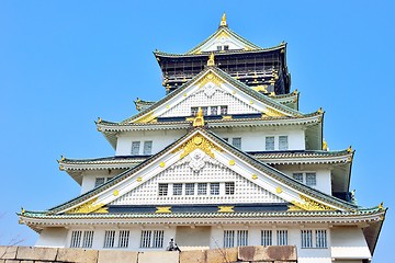 Image showing Osaka castle tower closeup with blue sky