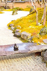 Image showing Tome ishi, a path blocking stone, on a small stone bridge