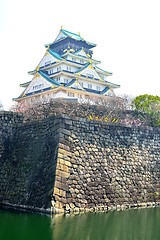 Image showing Osaka castle tower and stone moat