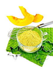 Image showing Flour pumpkin in glass cup on green napkin