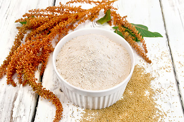 Image showing Flour amaranth in white bowl with flower on board