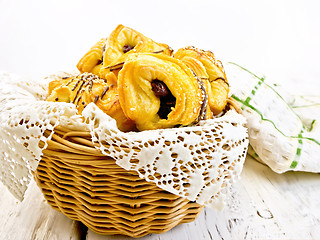 Image showing Cookies with dates in basket with napkin on board