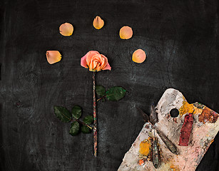 Image showing paint brushes and tubes of oil paints on wooden background