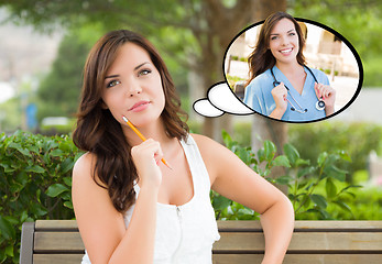 Image showing Thoughtful Young Woman with Herself as a Doctor or Nurse Inside 