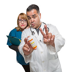 Image showing Goofy Doctor and Nurse with Prescription Bottle Isolated on a Wh