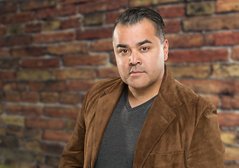 Image showing Handsome Young Hispanic Male Headshot Portrait Against Brick Wal