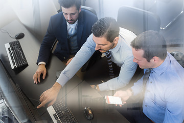 Image showing Business team analyzing data on computer.