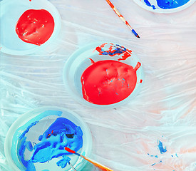 Image showing Red And Blue Paints In Plastic Plates