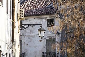 Image showing Old street lantern mounted on the wall of a building