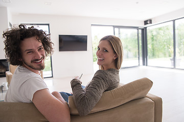 Image showing Rear view of couple watching television