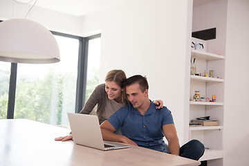 Image showing couple using laptop at home