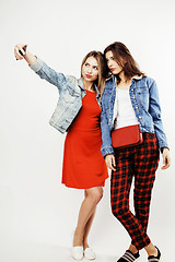 Image showing best friends teenage girls together having fun, posing emotional on white background, besties happy smiling, lifestyle people concept