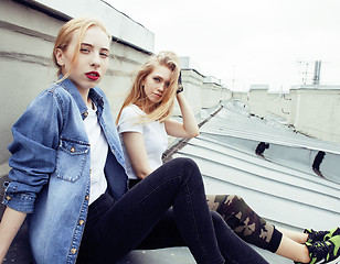 Image showing Two teenage girls infront of university building smiling, having fun traveling europe, lifestyle people concept 