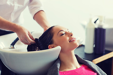 Image showing happy young woman at hair salon