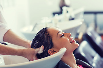 Image showing happy young woman at hair salon