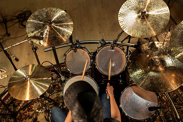 Image showing male musician playing drums and cymbals at concert