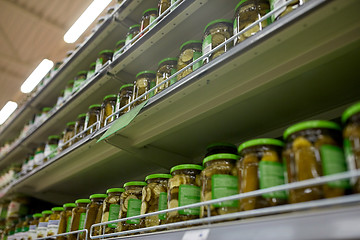 Image showing jars of pickles on grocery or supermarket shelves