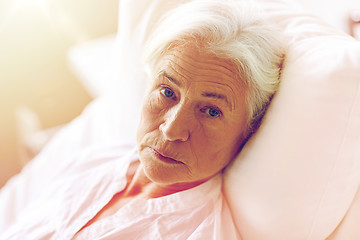 Image showing senior woman patient lying in bed at hospital ward