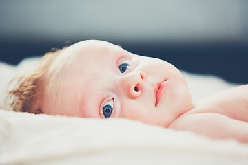 Image showing Cheerful baby with blue eyes