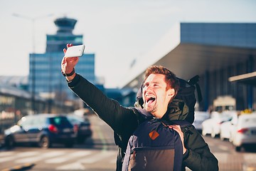 Image showing Traveler taking a selfie at the airport