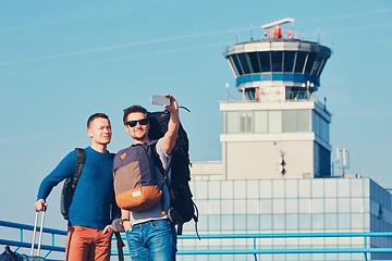 Image showing Travelers taking a selfie at the airport