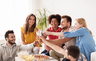 Image showing friends having party and clinking drinks at home