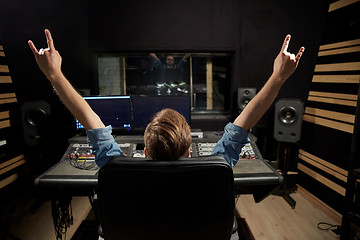 Image showing man at mixing console in music recording studio