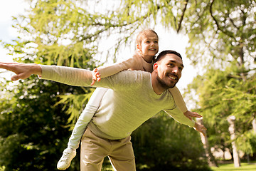 Image showing happy family having fun in summer park