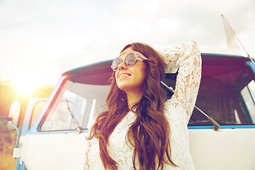 Image showing smiling young hippie woman in minivan car